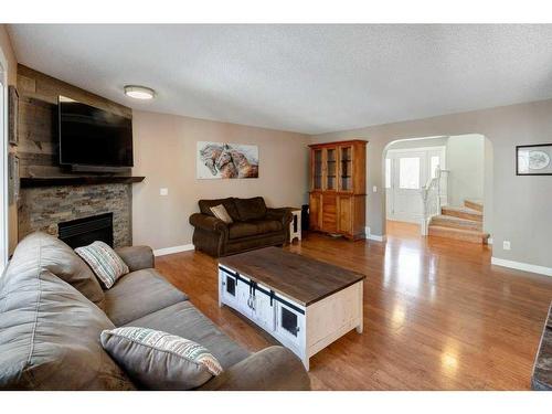 5 Bow Ridge Lane, Cochrane, AB - Indoor Photo Showing Living Room With Fireplace