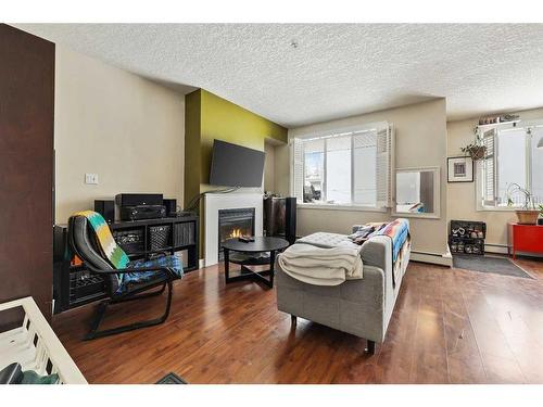 101-3501 15 Street Sw, Calgary, AB - Indoor With Fireplace