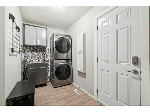 23 Suncanyon Park Se, Calgary, AB - Indoor Photo Showing Laundry Room