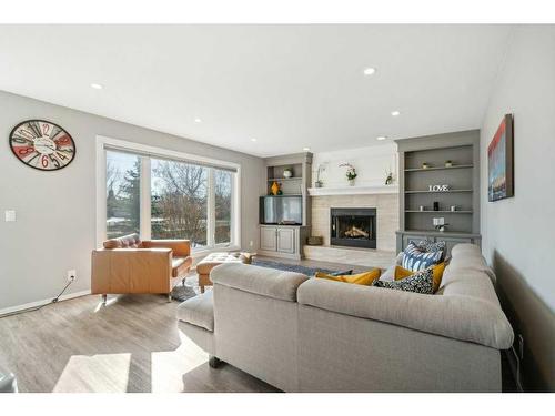23 Suncanyon Park Se, Calgary, AB - Indoor Photo Showing Living Room With Fireplace