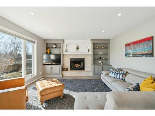 23 Suncanyon Park Se, Calgary, AB - Indoor Photo Showing Living Room With Fireplace