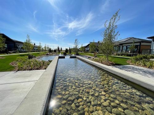 149 Marina Cove Se, Calgary, AB - Outdoor With Body Of Water