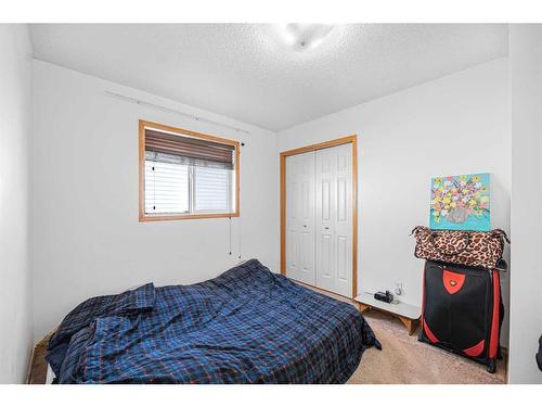 38 Arbour Butte Crescent Nw, Calgary, AB - Indoor Photo Showing Bedroom