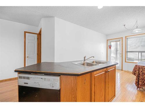 38 Arbour Butte Crescent Nw, Calgary, AB - Indoor Photo Showing Kitchen With Double Sink