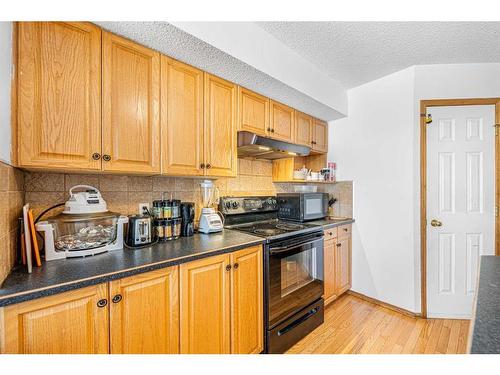 38 Arbour Butte Crescent Nw, Calgary, AB - Indoor Photo Showing Kitchen