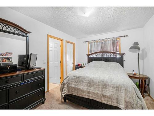 38 Arbour Butte Crescent Nw, Calgary, AB - Indoor Photo Showing Bedroom