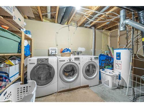 38 Arbour Butte Crescent Nw, Calgary, AB - Indoor Photo Showing Laundry Room