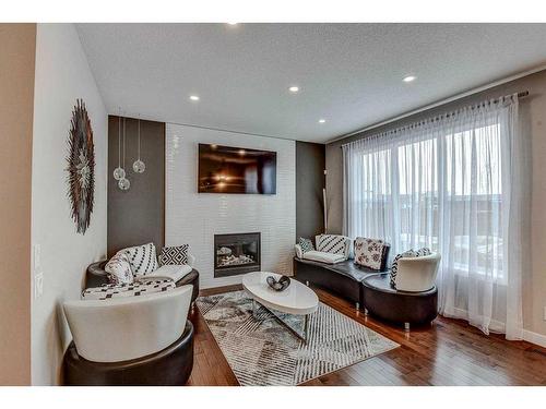 246 Legacy Heights Se, Calgary, AB - Indoor Photo Showing Living Room With Fireplace