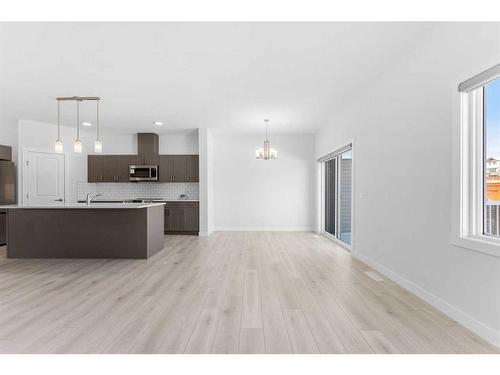 59 Belgian Crescent, Cochrane, AB - Indoor Photo Showing Kitchen