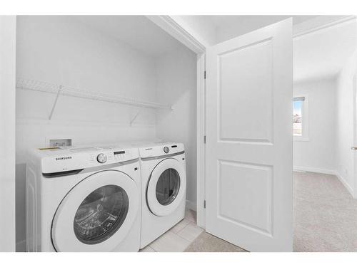 59 Belgian Crescent, Cochrane, AB - Indoor Photo Showing Laundry Room