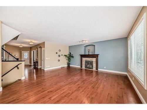 227 Everglade Circle Sw, Calgary, AB - Indoor Photo Showing Other Room With Fireplace