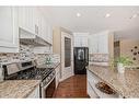 227 Everglade Circle Sw, Calgary, AB  - Indoor Photo Showing Kitchen With Upgraded Kitchen 