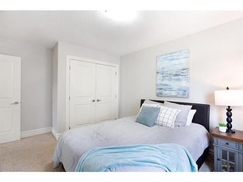 653 Coopers Crescent Sw, Airdrie, AB - Indoor Photo Showing Bedroom
