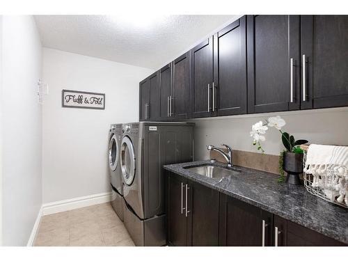 653 Coopers Crescent Sw, Airdrie, AB - Indoor Photo Showing Laundry Room