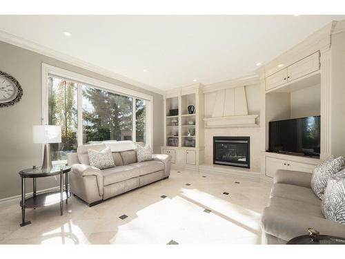 11 Aspen Ridge Lane Sw, Calgary, AB - Indoor Photo Showing Living Room With Fireplace