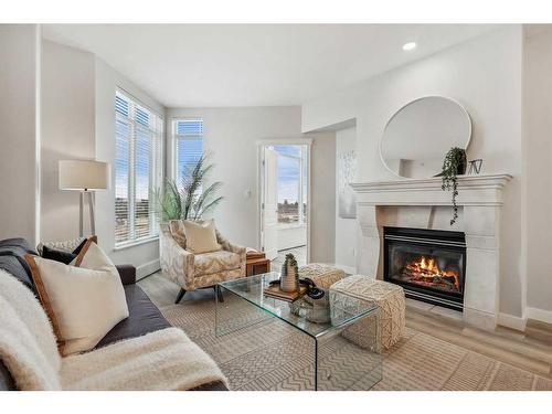 105-1718 14 Avenue Nw, Calgary, AB - Indoor Photo Showing Living Room With Fireplace