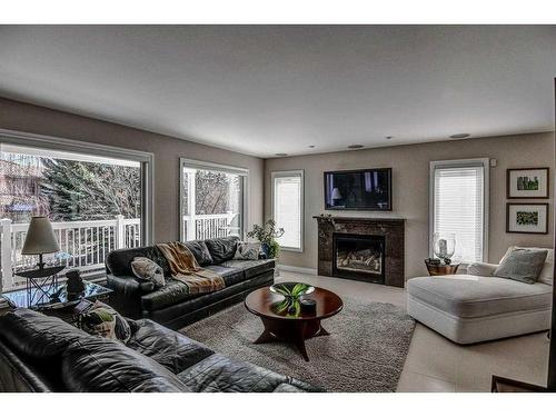 32 Patterson Crescent Sw, Calgary, AB - Indoor Photo Showing Living Room With Fireplace