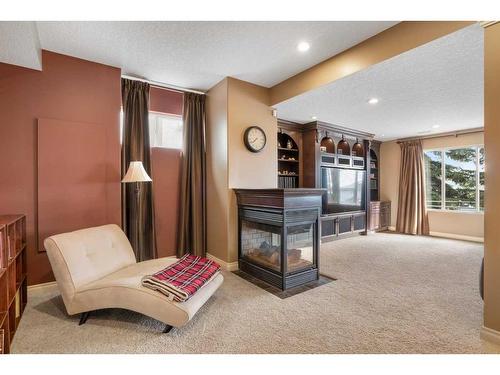 143 Arbour Stone Rise Nw, Calgary, AB - Indoor With Fireplace