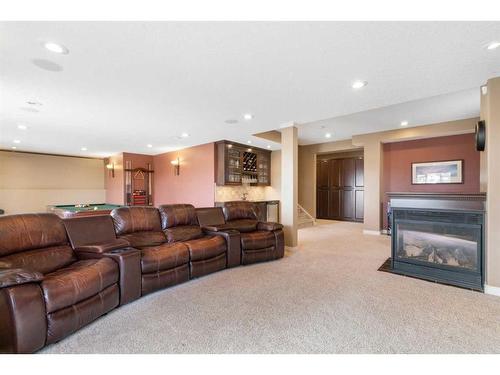 143 Arbour Stone Rise Nw, Calgary, AB - Indoor Photo Showing Living Room With Fireplace