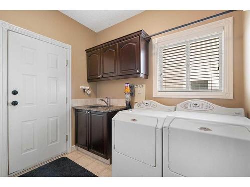 143 Arbour Stone Rise Nw, Calgary, AB - Indoor Photo Showing Laundry Room