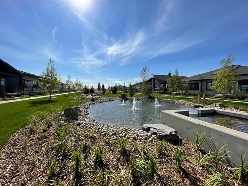 119 Marina Cove Se, Calgary, AB - Outdoor With Body Of Water