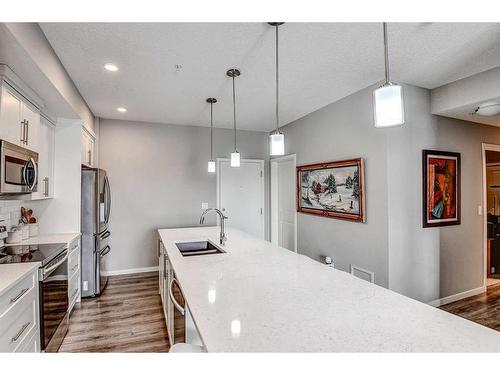 301-4350 Seton Drive Se, Calgary, AB - Indoor Photo Showing Kitchen With Upgraded Kitchen