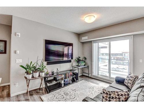 301-4350 Seton Drive Se, Calgary, AB - Indoor Photo Showing Living Room