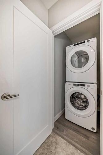 408 Shawnee Square Sw, Calgary, AB - Indoor Photo Showing Laundry Room