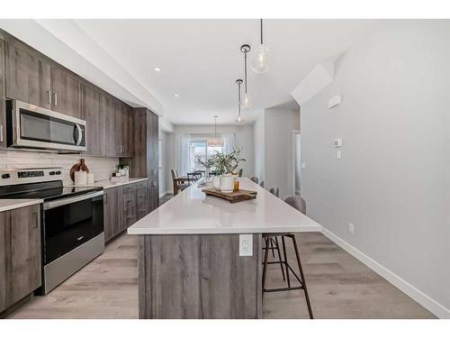 408 Shawnee Square Sw, Calgary, AB - Indoor Photo Showing Kitchen With Upgraded Kitchen
