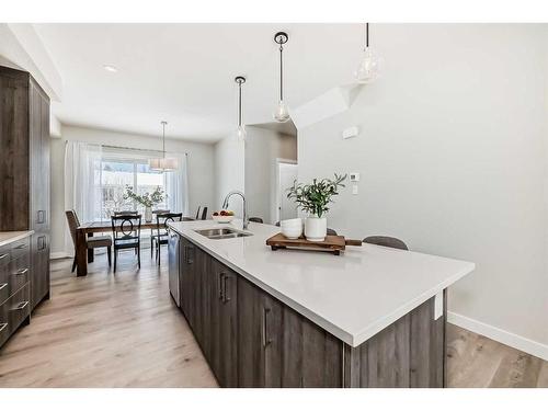 408 Shawnee Square Sw, Calgary, AB - Indoor Photo Showing Kitchen With Double Sink