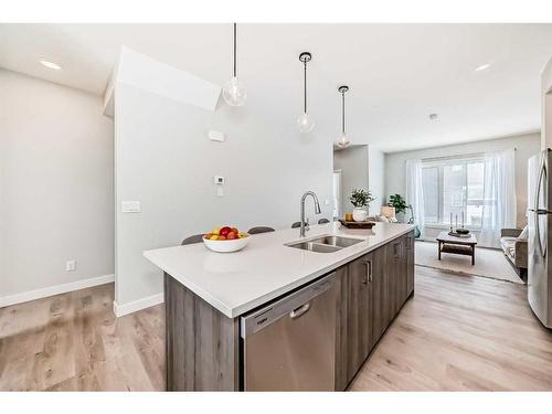 408 Shawnee Square Sw, Calgary, AB - Indoor Photo Showing Kitchen With Double Sink With Upgraded Kitchen