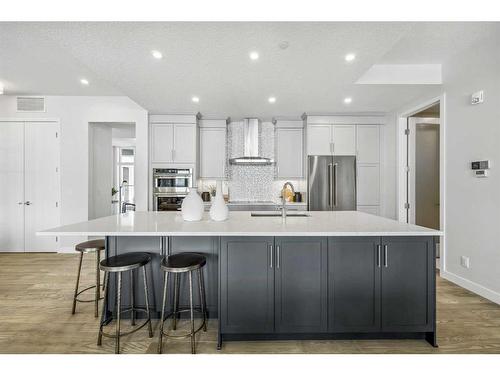201-110 Marina Cove Se, Calgary, AB - Indoor Photo Showing Kitchen With Stainless Steel Kitchen With Upgraded Kitchen