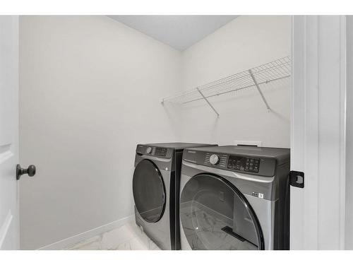 59 Setonstone Row Se, Calgary, AB - Indoor Photo Showing Laundry Room