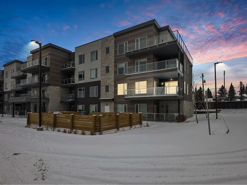 215-200 Shawnee Square Sw, Calgary, AB - Outdoor With Balcony With Facade