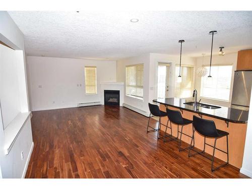 340-22 Richard Place Sw, Calgary, AB - Indoor With Fireplace