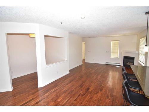 340-22 Richard Place Sw, Calgary, AB - Indoor With Fireplace