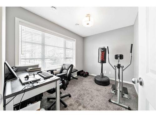 1010 Evansridge Park Nw, Calgary, AB - Indoor Photo Showing Gym Room