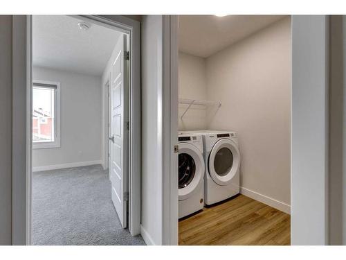 113 Creekside Way Sw, Calgary, AB - Indoor Photo Showing Laundry Room
