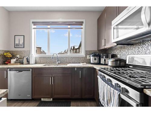 614 Copperpond Boulevard Se, Calgary, AB - Indoor Photo Showing Kitchen With Stainless Steel Kitchen