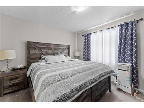 614 Copperpond Boulevard Se, Calgary, AB - Indoor Photo Showing Bedroom