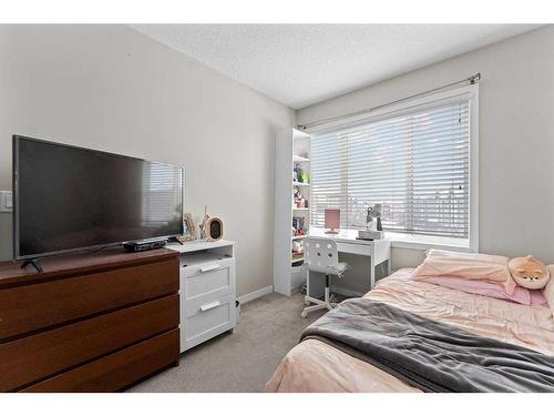 614 Copperpond Boulevard Se, Calgary, AB - Indoor Photo Showing Bedroom