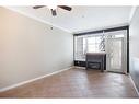 1101-1010 Arbour Lake Road Nw, Calgary, AB  - Indoor With Fireplace 
