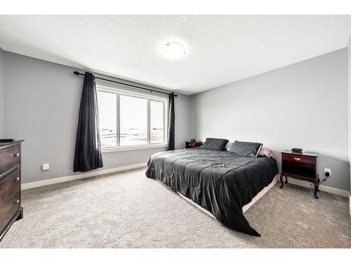 612 Edgefield Street, Strathmore, AB - Indoor Photo Showing Bedroom
