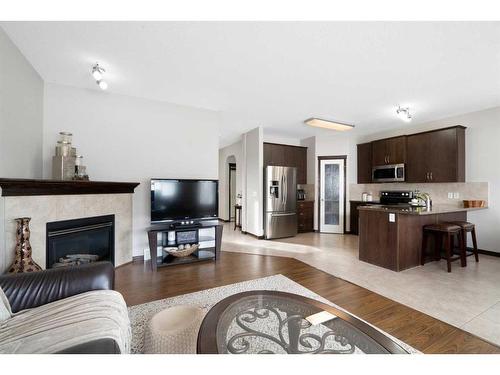 122 Saddleland Crescent Ne, Calgary, AB - Indoor Photo Showing Living Room With Fireplace