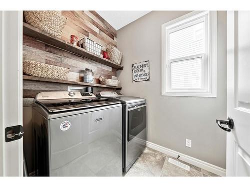 137 Heritage Hill, Cochrane, AB - Indoor Photo Showing Laundry Room