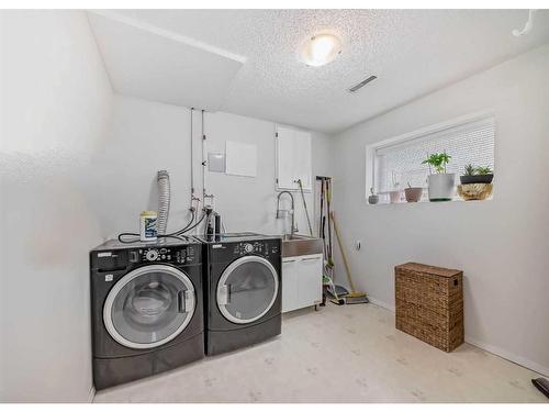 23 Sanderling Rise Nw, Calgary, AB - Indoor Photo Showing Laundry Room