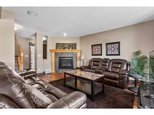 84 Everbrook Drive Sw, Calgary, AB - Indoor Photo Showing Living Room With Fireplace