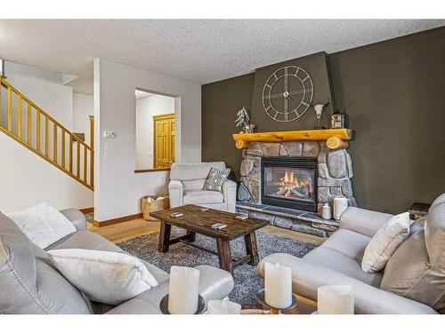 215 Miskow Close, Canmore, AB - Indoor Photo Showing Living Room With Fireplace