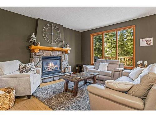 215 Miskow Close, Canmore, AB - Indoor Photo Showing Living Room With Fireplace