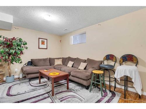 143 Saddlemont Crescent Ne, Calgary, AB - Indoor Photo Showing Living Room